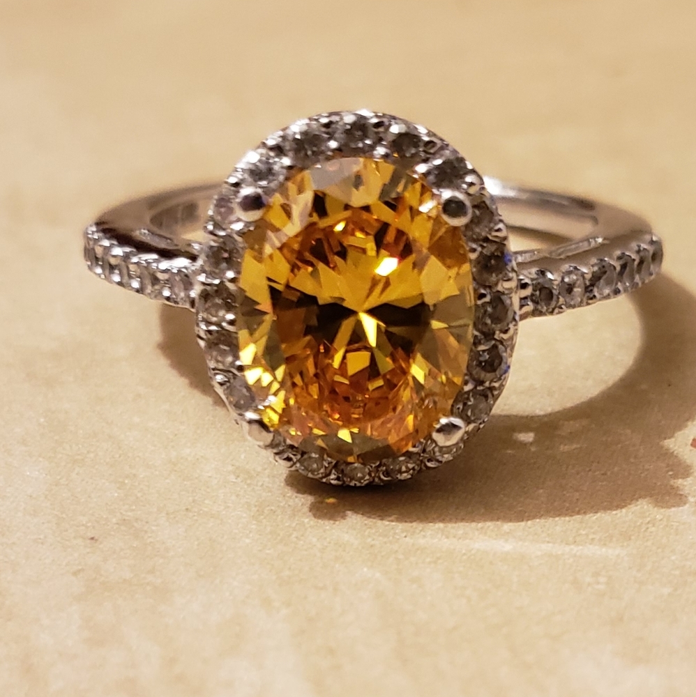 QVC Diamonique canary oval stone w/halo setting